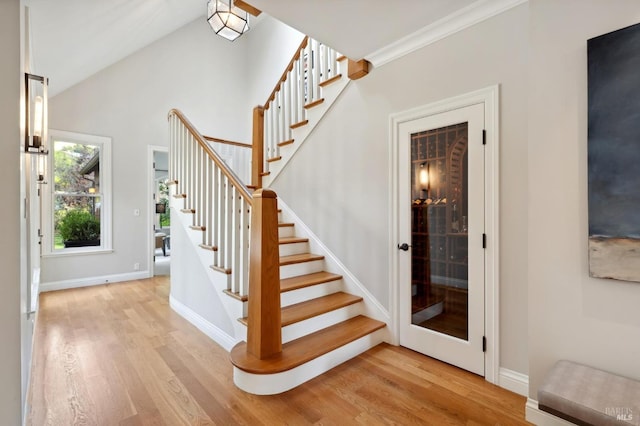 114 Van Tassel Ct, San Anselmo, CA 94960 - stairway with baseboards, wood finished floors, and vaulted ceiling