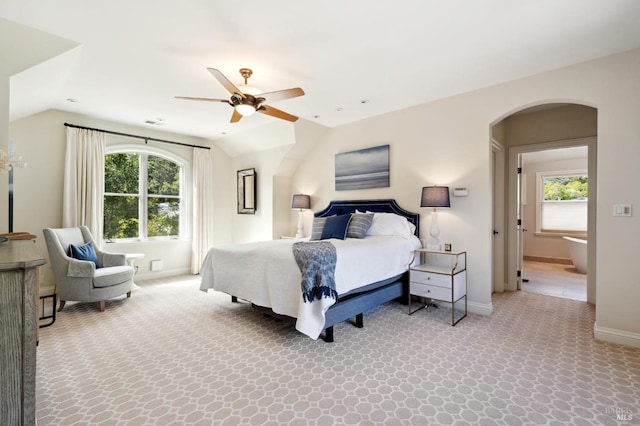 bedroom with ceiling fan, lofted ceiling, and carpet flooring