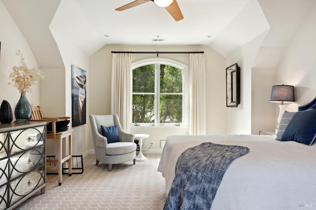 bedroom featuring light carpet, lofted ceiling, and ceiling fan