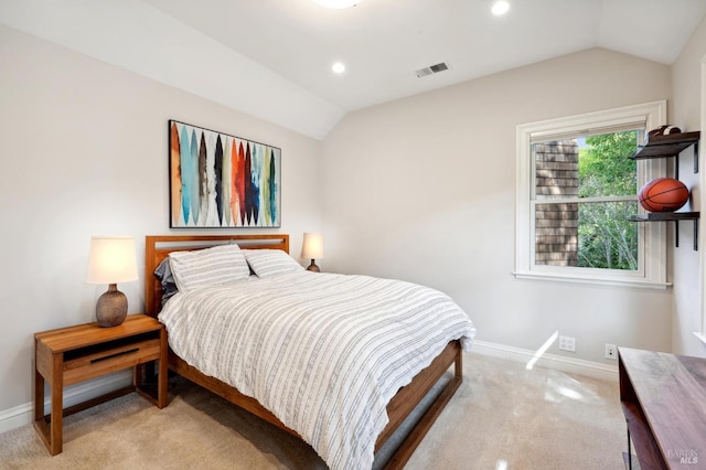 bedroom featuring light carpet and lofted ceiling