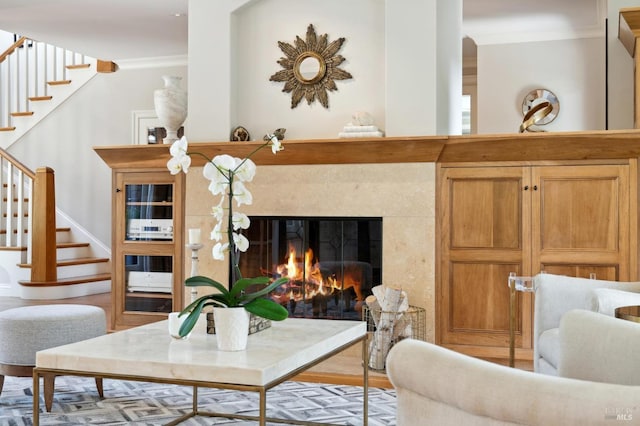114 Van Tassel Ct, San Anselmo, CA 94960 - living area with crown molding, a high end fireplace, arched walkways, wood finished floors, and stairs