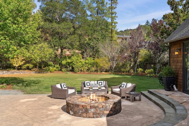 view of patio / terrace with an outdoor fire pit