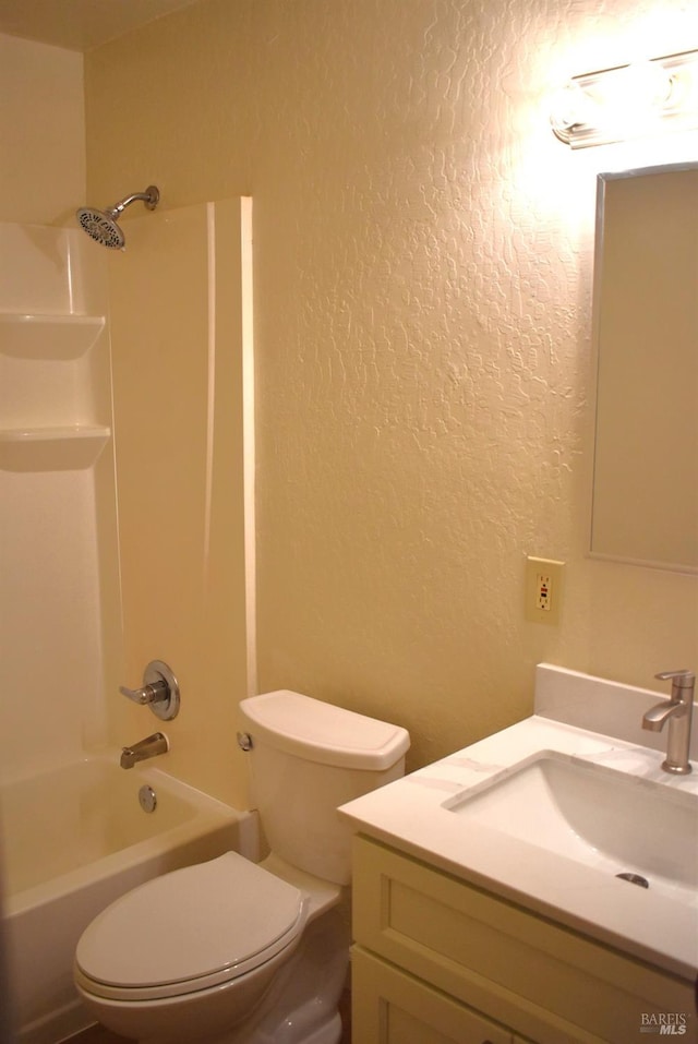 full bathroom with vanity, toilet, and  shower combination