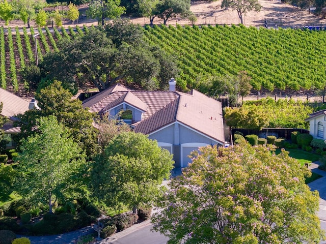 birds eye view of property with a rural view