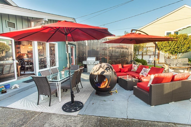 view of patio with grilling area and outdoor lounge area