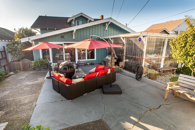 view of front facade featuring a patio and an outdoor living space