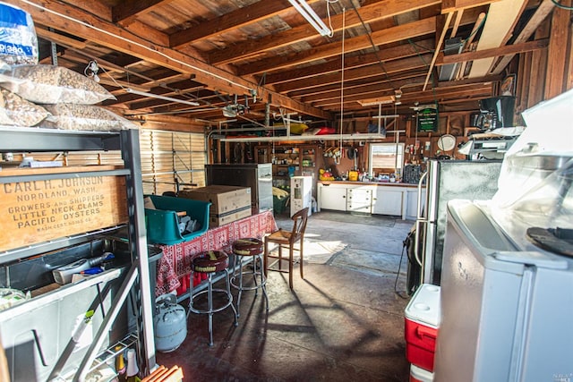 basement with washer / clothes dryer and a workshop area