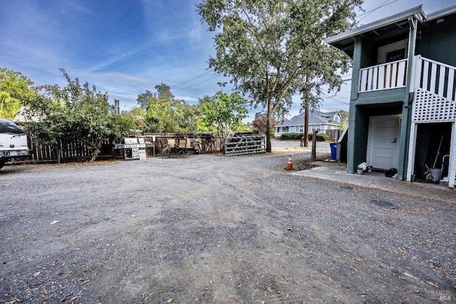 view of yard featuring a balcony