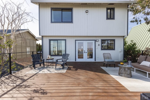 back of house featuring french doors, an outdoor hangout area, and a deck