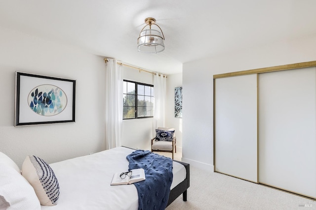 carpeted bedroom with a closet