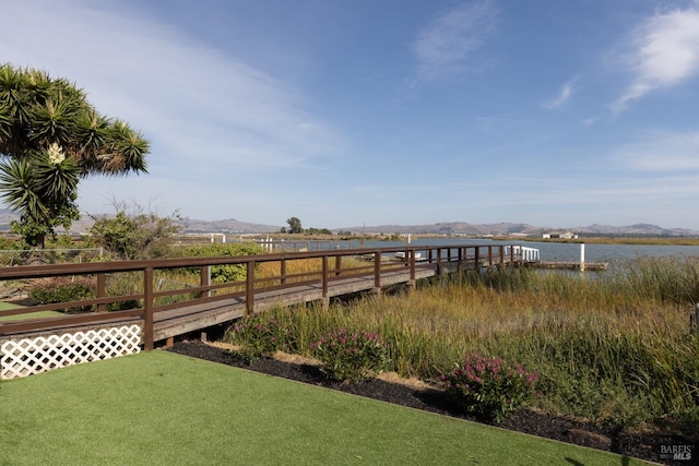 exterior space with a water and mountain view