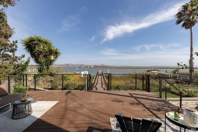 wooden terrace with a water view