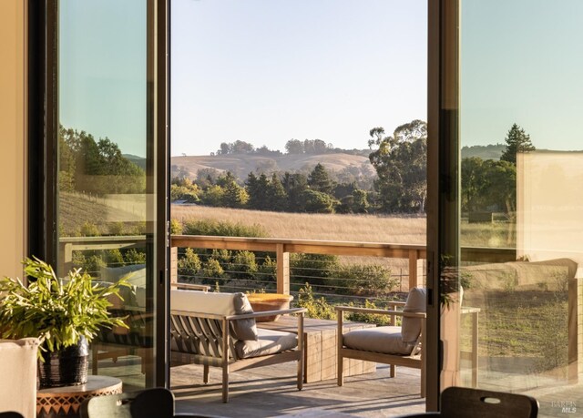 balcony featuring a mountain view and a rural view