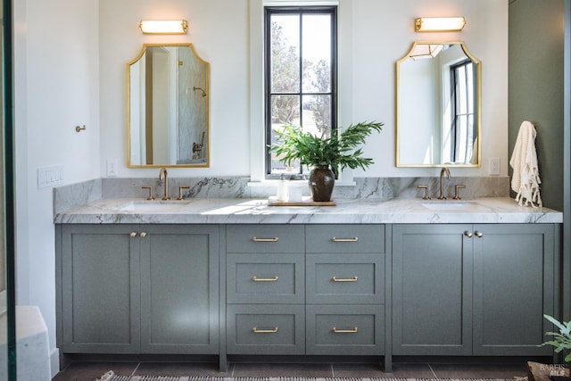 bathroom with tile patterned floors and vanity