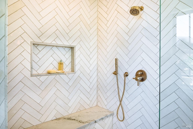 bathroom with a tile shower