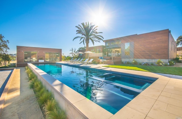 view of swimming pool featuring a patio area