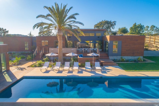 view of swimming pool featuring a patio area