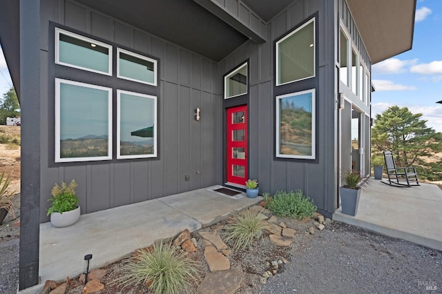 doorway to property featuring board and batten siding