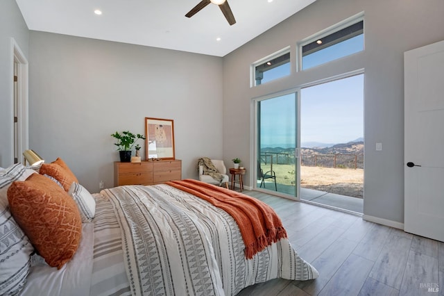 bedroom featuring recessed lighting, a ceiling fan, wood finished floors, access to outside, and baseboards