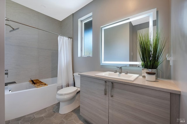 full bathroom with vanity, shower / tub combo, tile patterned flooring, and toilet