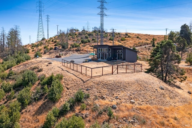 rear view of property with fence