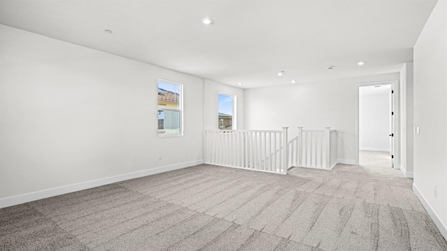 empty room with light colored carpet