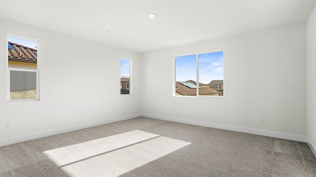 unfurnished room featuring carpet flooring