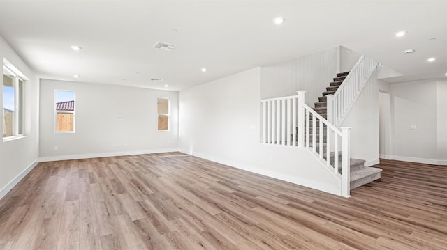 unfurnished room with light hardwood / wood-style floors