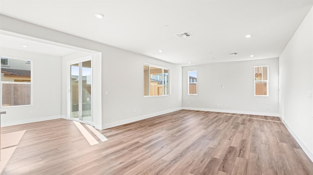 spare room featuring light wood-type flooring