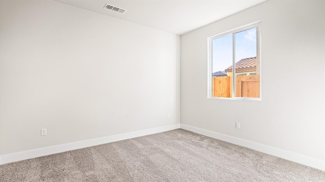 unfurnished room featuring carpet