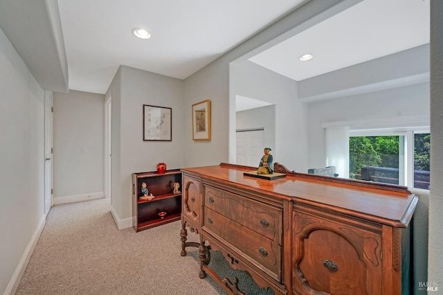 interior space featuring recessed lighting, light colored carpet, and baseboards