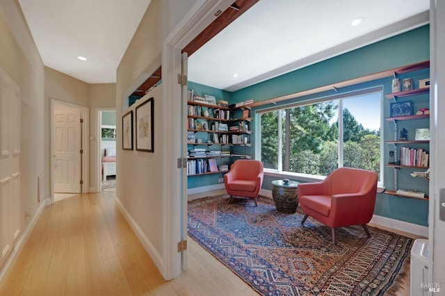 sitting room featuring recessed lighting, baseboards, and wood finished floors