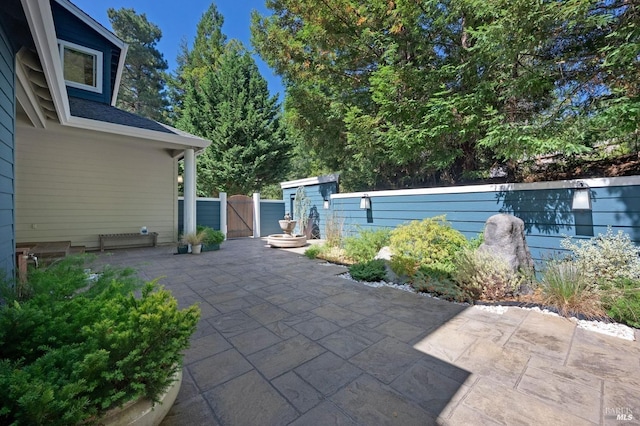 view of patio / terrace with a gate and fence