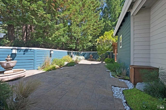 view of patio / terrace featuring fence