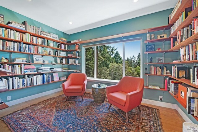 living area featuring hardwood / wood-style flooring