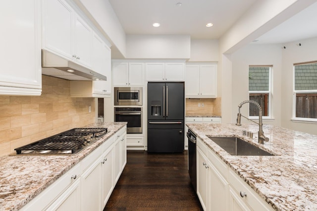 kitchen featuring sink, white cabinetry, black appliances, dark hardwood / wood-style flooring, and light stone countertops