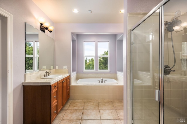 bathroom featuring shower with separate bathtub, plenty of natural light, and vanity