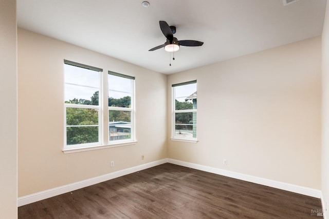 unfurnished room featuring ceiling fan and dark hardwood / wood-style floors