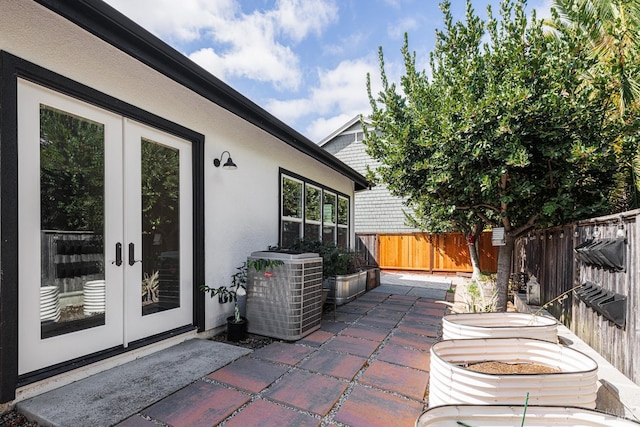 view of patio / terrace with central AC and french doors