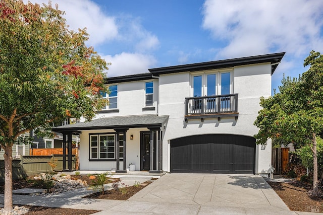 view of front of property with a balcony and a garage