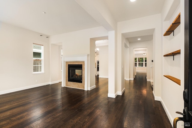 living room featuring a fireplace and dark hardwood / wood-style flooring