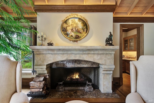 living room with wood ceiling, beam ceiling, hardwood / wood-style floors, and a high end fireplace