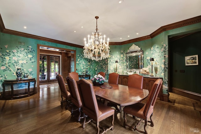 dining room featuring wood-type flooring, a notable chandelier, crown molding, and french doors