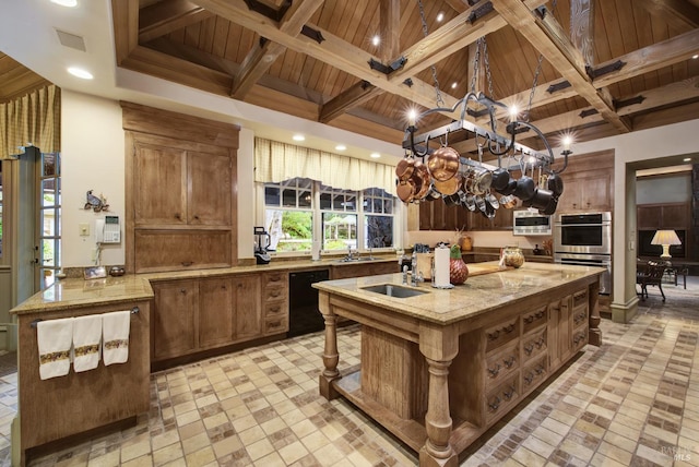 kitchen with sink, beam ceiling, a kitchen island with sink, stainless steel appliances, and wooden ceiling