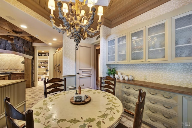 dining room featuring an inviting chandelier and crown molding