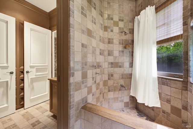 bathroom featuring a shower with shower curtain and ornamental molding