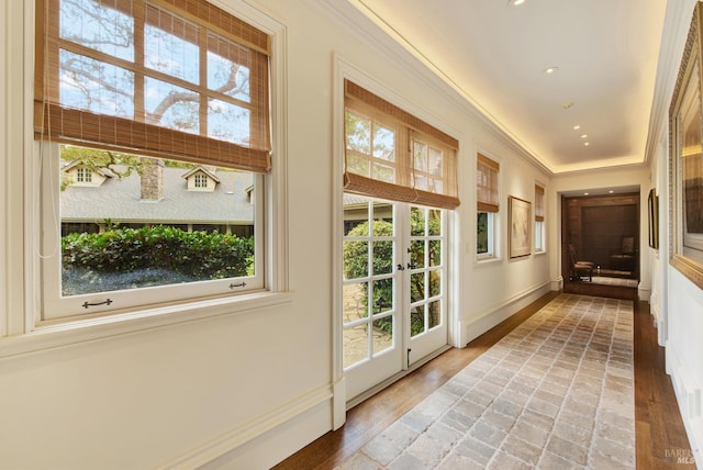 entryway featuring hardwood / wood-style flooring, french doors, and crown molding