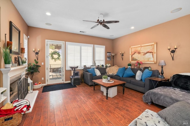 living room with ceiling fan and hardwood / wood-style flooring