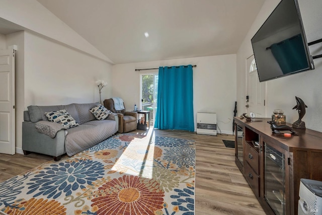 living room with lofted ceiling and light hardwood / wood-style floors