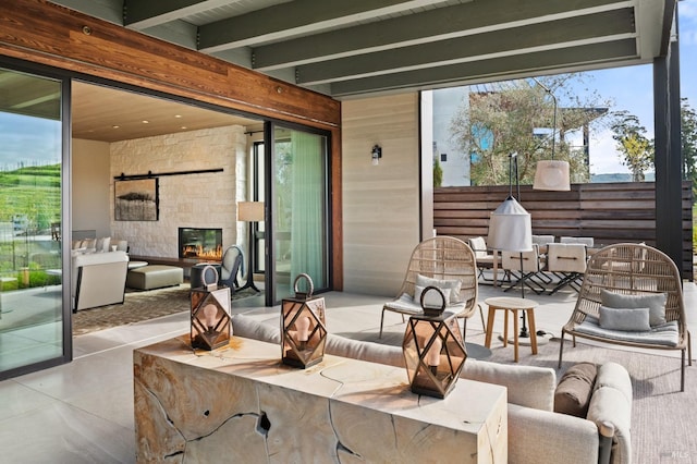 view of patio with an outdoor living space and outdoor dining area